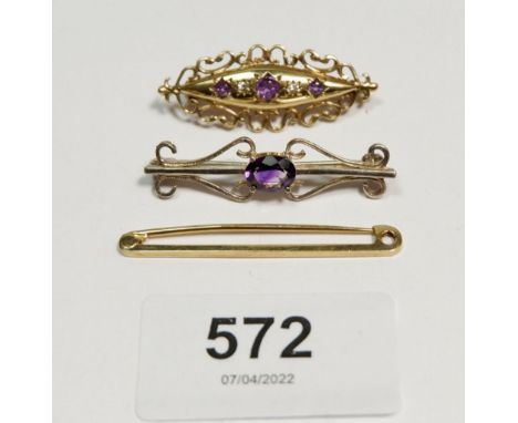 A Victorian 9 carat gold brooch set amethyst and chip diamonds, 3.7cm long, 3.6g, a 9 carat gold tie pin, 1.7g and a silver b