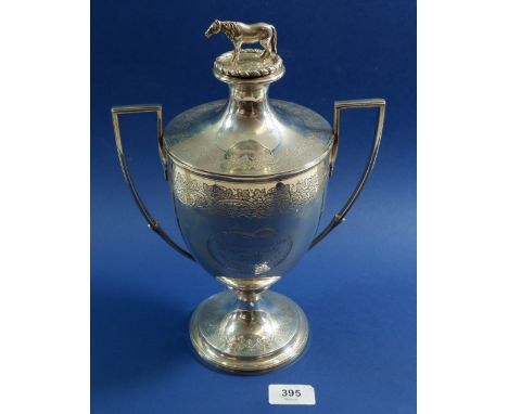 An early 19th century silver agricultural two handled trophy cup with horse finial to lid, 890g, by Charles Hollinshed, Londo