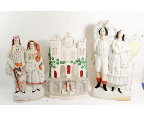 A Victorian Staffordshire large group with man and woman playing harp and squeeze box - 43cm, a clock tower group and a Scott