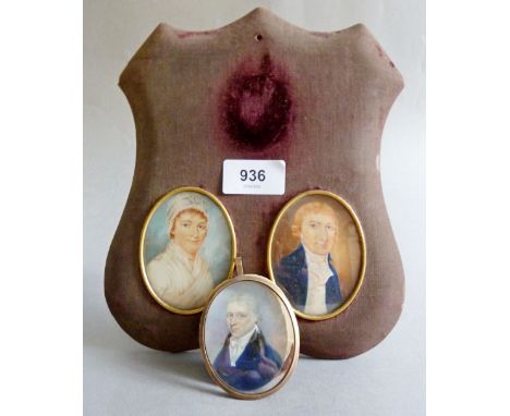 A pair of early 19th century watercolour on ivory miniatures of gentleman and a lady and a further watercolour portrait of a 