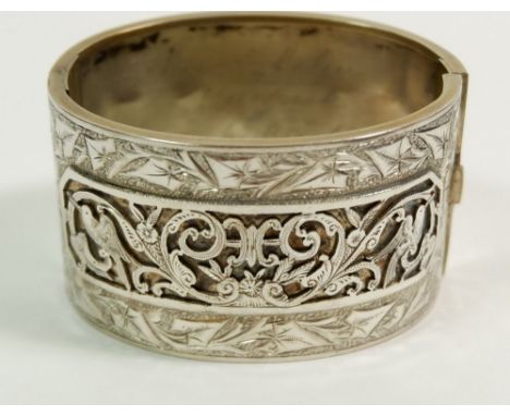 A Victorian white metal hinged cuff bangle with engraved and applied decoration, engraved within 'Sarah Holm Brighouse' 