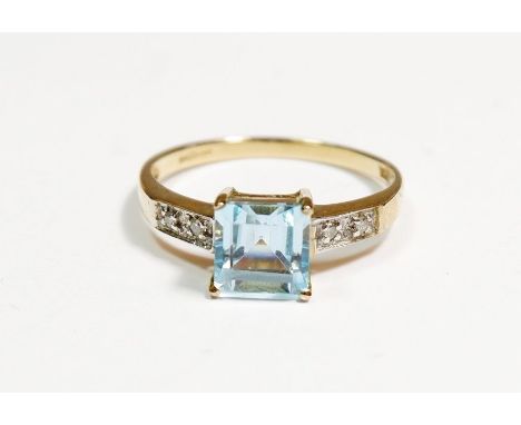 A 9 carat gold ring set aquamarine on diamond set shoulders, size N, 1.8g 