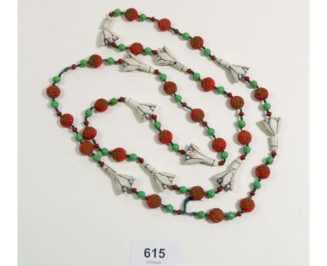 An oriental ceramic bead necklace in red, white and green 