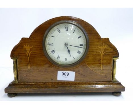 An Edwardian oak mantel clock with French eight day movement, inlay and key 