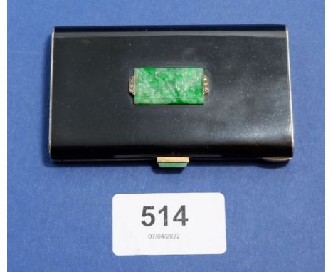A French Art Deco black enamel and gilt silver or white metal compact inset 'jade' and marcasite plaque and clasp, with boars