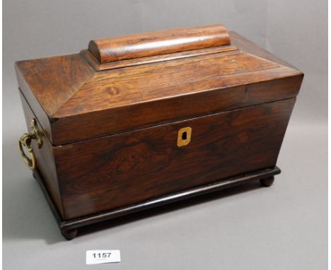 A 19th century rosewood sarcophagus form tea caddy with fitted interior 