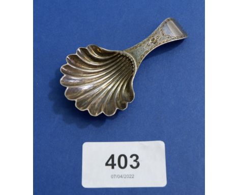 A silver shell bowl caddy spoon with bright cut handle by Hester Bateman, London 1784 