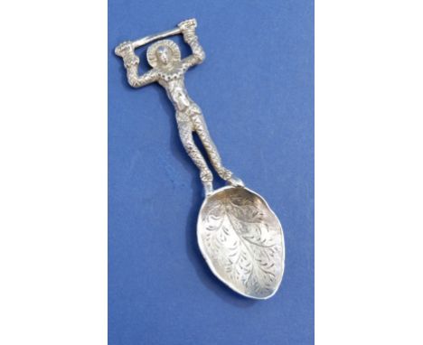 A silver caddy spoon in the form of a harlequin, London 1881 by Thomas James, 11cm, 45g