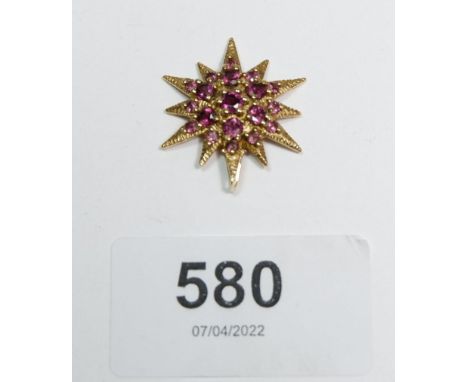 A 9 carat gold ruby set star pendant, 2.7cm long, marked Birmingham, 3g 