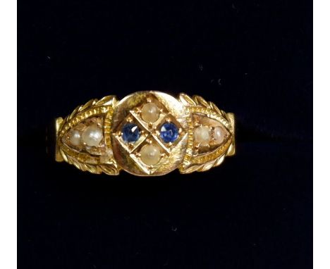 A Victorian 15 carat gold ring set seed pearls and sapphires, size K 