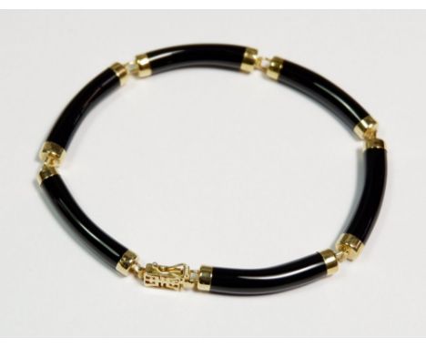 A vintage 14 carat gold and onyx panel link bracelet, marked 14k Hong Kong and Birmingham import marks for 1998. Measures 19c