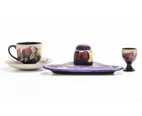 William Moorcroft (1872-1945),  a 'Wisteria' egg cup, for Moorcroft Pottery, glazed earthenware, impressed 'Moorcroft, Made i