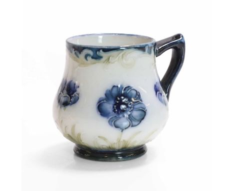 William Moorcroft (1872-1945), a rare miniature 'Poppy' coffee mug, for James Macintyre &amp; Co., glazed earthenware, with p