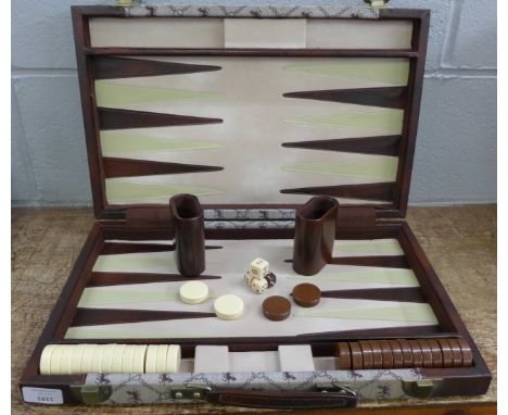 A backgammon set, cased **PLEASE NOTE THIS LOT IS NOT ELIGIBLE FOR POSTING AND PACKING** 