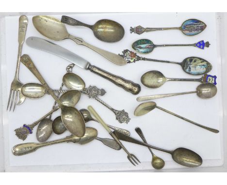 Silver spoons and a pastry fork including 19th Century and later enamelled souvenir spoons, 185g, other spoons and a knife 
