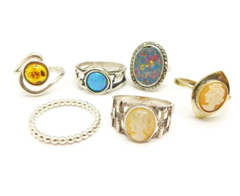 Six silver rings, (synthetic opal a/f) 