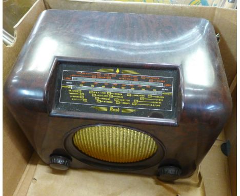 A Bush DAC 90A Bakelite radio, a Raymond Electric Bakelite speaker and one other smaller plus a Ferranti Bakelite electric ma