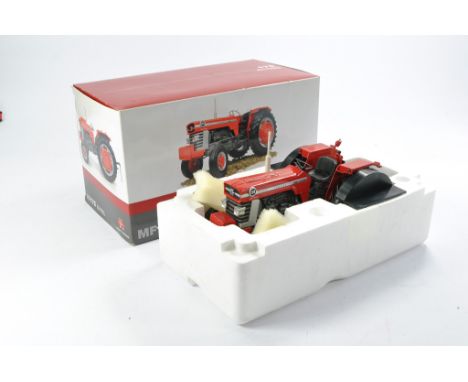Universal Hobbies 1/16 Massey Ferguson 175 Tractor. Looks to be complete, rear adapter loose in box, no significant faults in