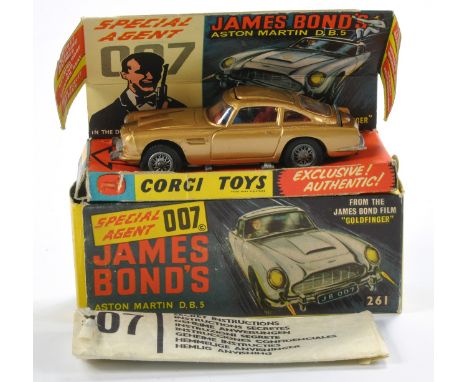 Corgi No. 261 James Bond 007 Aston Martin DB5. Gloss 'Toffee' Gold with red interior and Light Tan ejector roof (as shown). G