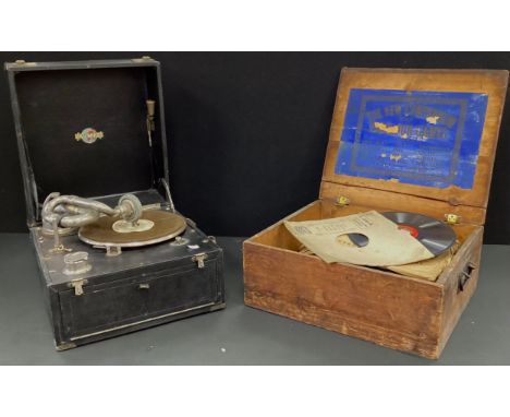 A Gilbert mechanical gramophone, with a selection of vintage records, in a pine lidded crate, (2).