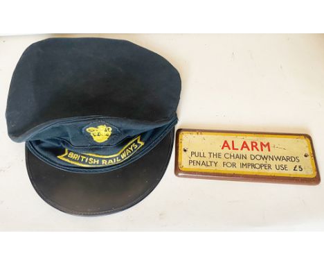 British Railways Porters Cap size 7.25 with sew on fishtail style badge and sew on lion holding wheel badge. Together with a 