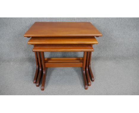 A nest of three vintage teak occasional tables. H.48 W.58 D.43cm 