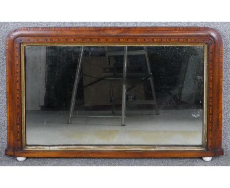 A Victorian walnut Tunbridge inlaid overmantel mirror with original plate in gilt slip resting on ceramic ball feet. H.56 W.9