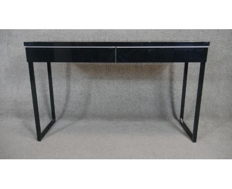 A contemporary console table fitted with a pair of frieze drawers. H.75 W.120 D.40cm 