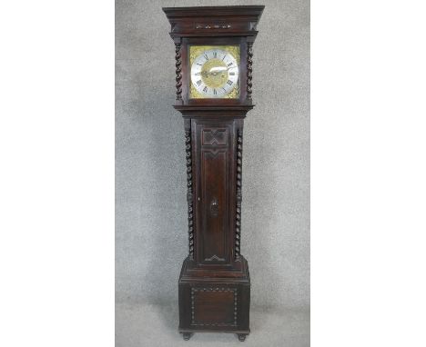 An oak cased longcase clock with eight day movement and brass and steel dial with weights and pendulum. H.183cm 