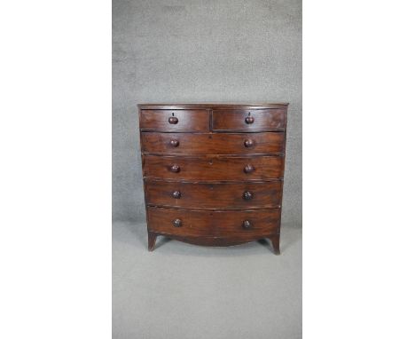A Georgian mahogany chest with shaped apron on swept bracket supports. h117 w106 d55 