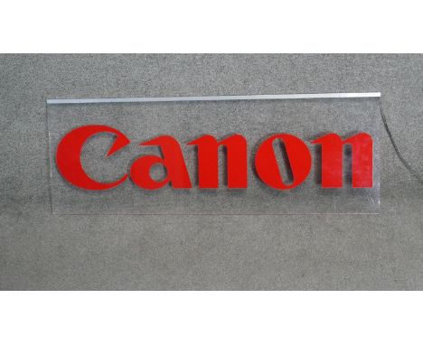 A vintage light up acryclic Canon camera advertising sign. (adapter and plug missing) H.36 W.100cm 