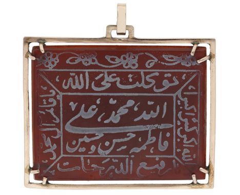 An Islamic intaglio pendant, the rectangular plaque with carved and painted Islamic religious script and flowerheads, to a pl