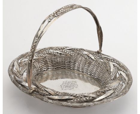 A Victoria silver bread basket, the basket weave body relief-decorated with ears of corn, within a moulded border cast at int
