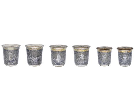 Three matching  Russian silver and niello beakers, reserving oval panels of a hunting scene, a statue of Peter the Great and 