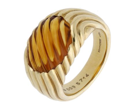 A citrine ring by Boucheron, the reeded citrine cabochon in a tapering bombé mount of similar design, signed, French assay ma