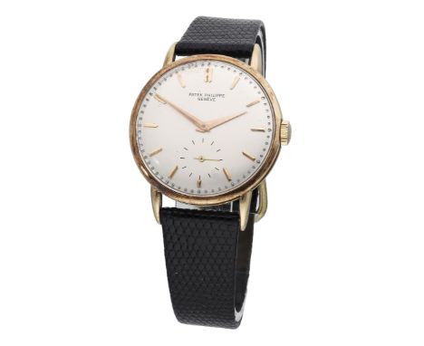 Patek Philippe. A gold wristwatch, circa 1960. Movement: manual winding, no. 965387. Dial: silvered, applied baton indexes, s