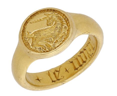 A unicorn gold seal ring, 15th - 16th century, the heavy ring with round bezel intaglio carved with a unicorn restant within 
