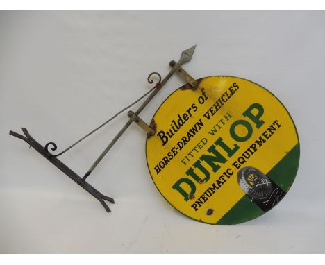 An early Dunlop 'Builders of Horse-Drawn Vehicles' part pictorial double sided circular enamel sign on a bracket, the sign 24