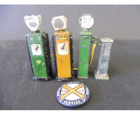 Four die-cast miniature petrol pumps, two in BP livery plus a Redex badge. 