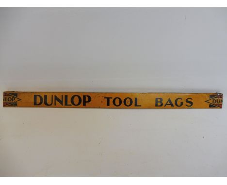 A Dunlop Tool Bags advertising shelf strip.