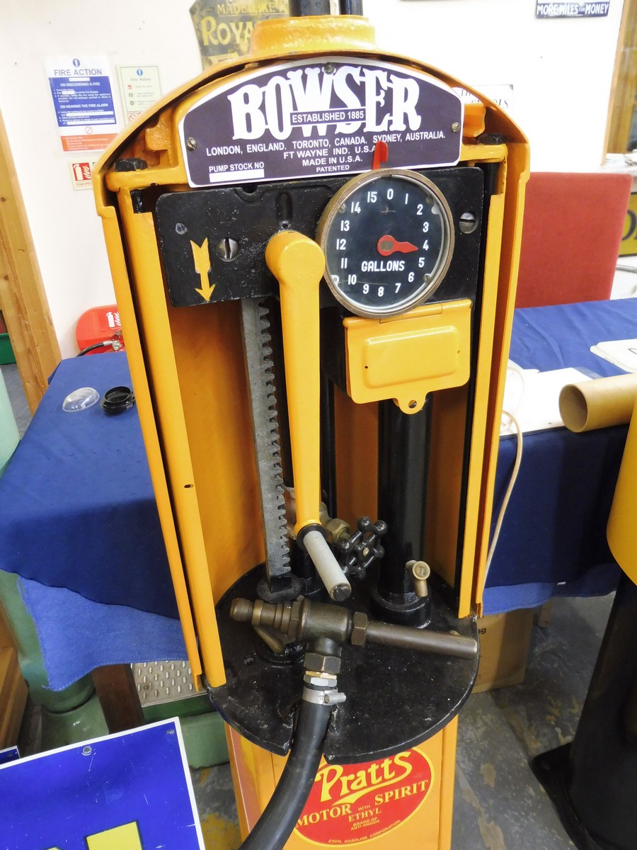 A Bowser petrol pump, fully restored in Pratts livery, with hose and