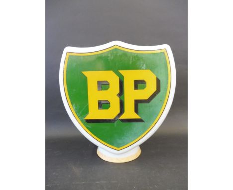 A BP shield shaped glass petrol pump globe, one side badly damaged and faded. 