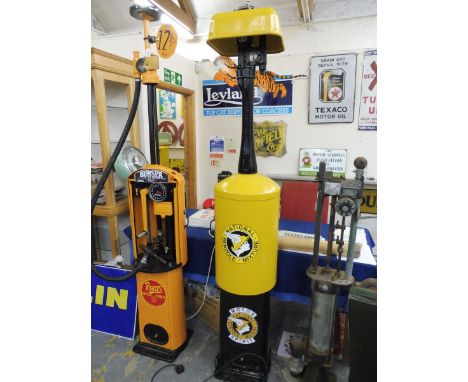 A Bowser hand operated petrol pump restored in National Benzole Mixture colours with modern decals. 