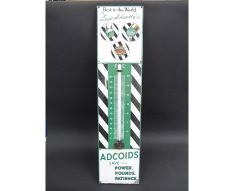 A Duckhams Adcoids black and white enamel thermometer.