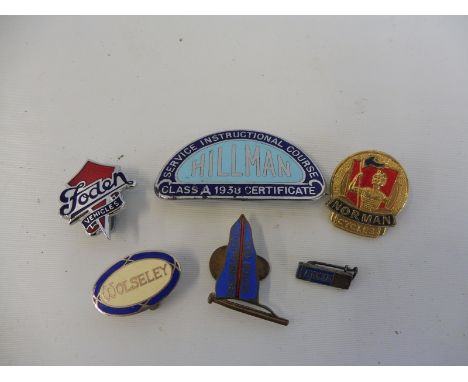 A selection of advertising motoring lapels and badges including Redline Motor Spirit, Wolseley, Foden, Lancia, Norman cycle e
