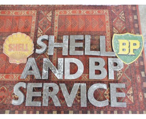 A rare collection of aluminium garage letters spelling 'Shell and BP Service' plus two Shell/BP emblem plaques. 