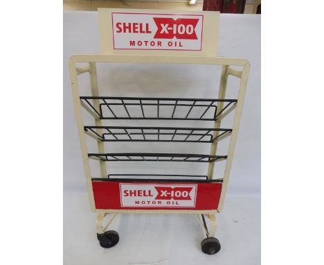 A Shellmex and BP Ltd oil bottle trolly restored in Shell colours and with a reproduction pediment.