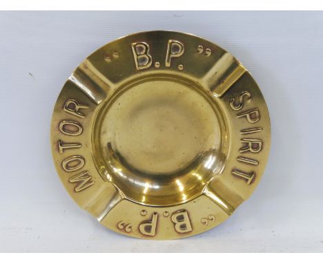 A BP Motor Spirit polished brass ashtray.