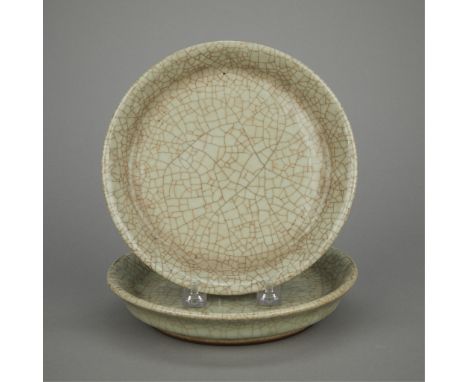 Pair of antique Chinese porcelain dishes with a celadon crackle glaze.(Each) height: 1 1/2 in x diameter: 7 3/4 in.Condition: