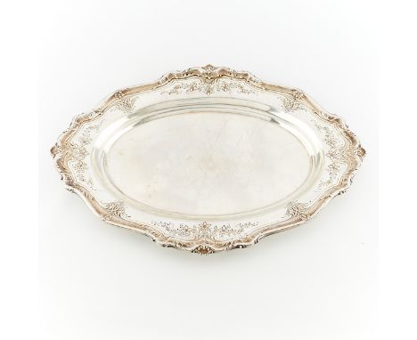 Redlich &amp; Company, United States. Sterling silver tray or platter with repousse and etched flowers and scrollwork along t
